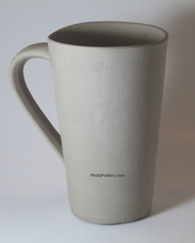 Sample large pottery mug hand-made on plaster cup mold. In porcelain, greenware state.
