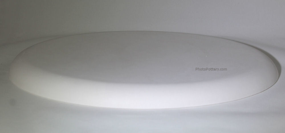Large oval plaster mold for making pottery plates, trays. Mold shown inverted.