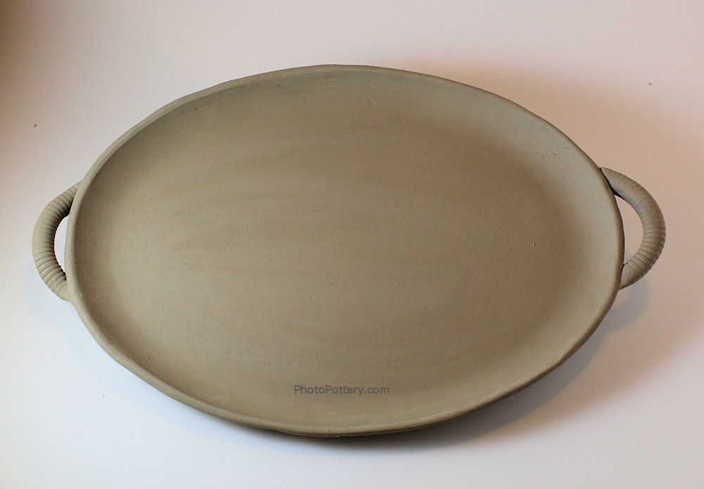 Sample ceramic serving tray made on oval plaster plate mold. Porcelain clay, unfired.