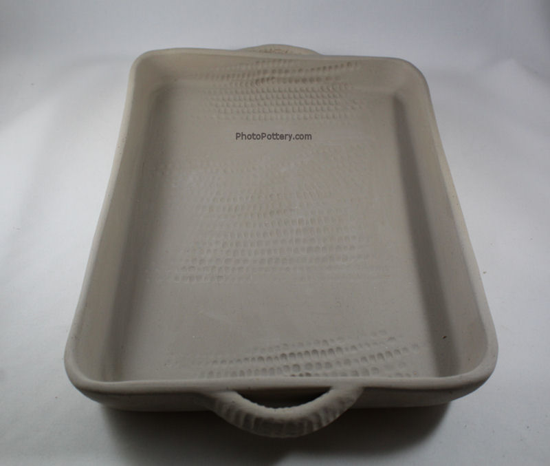 Sample rectangular pottery tray made on plaster hump mold, with added handles. Stoneware clay, greenware.