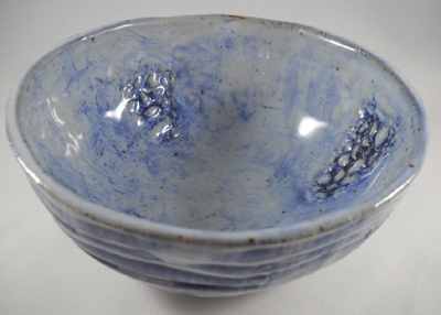 Stoneware pottery bowl hand-built using plaster mold.